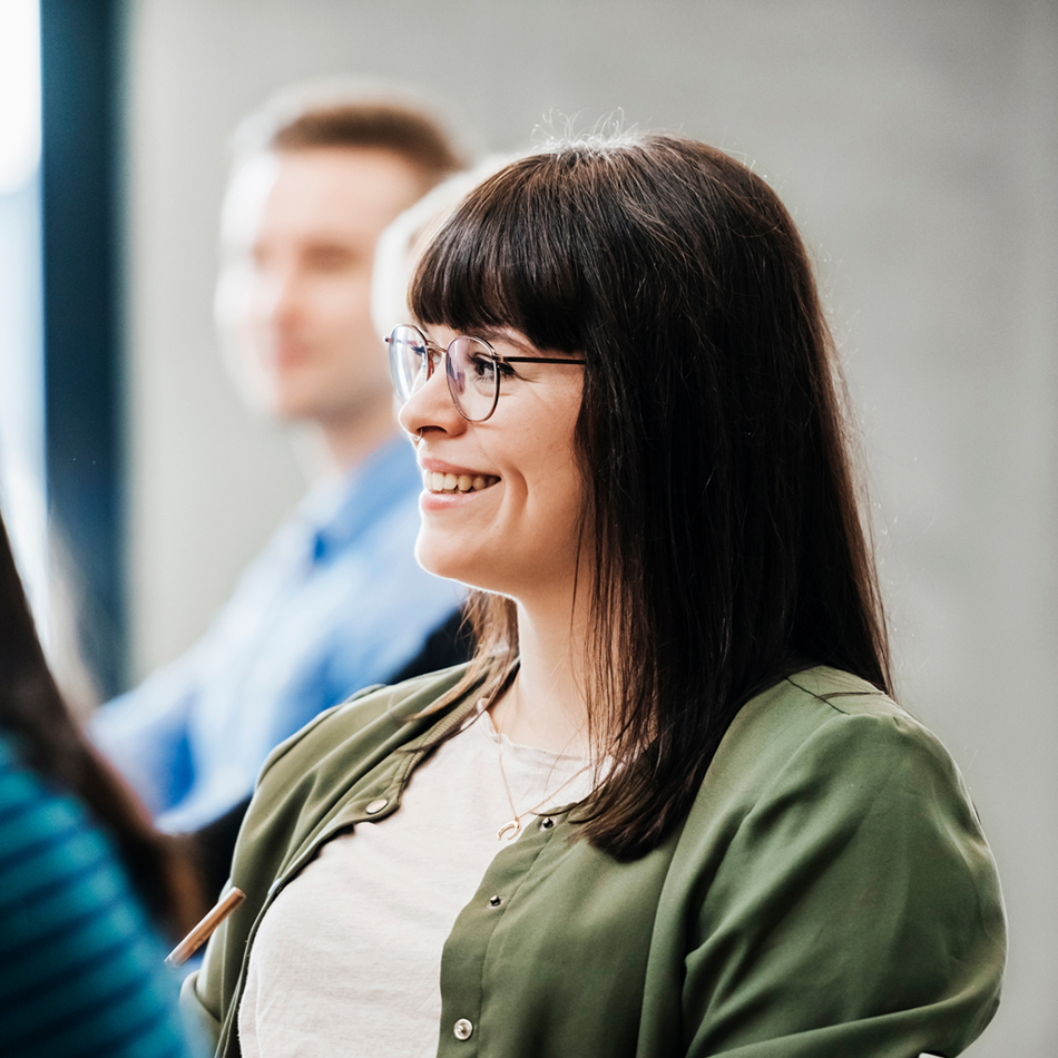 Smiling woman in a conference or lecture room
