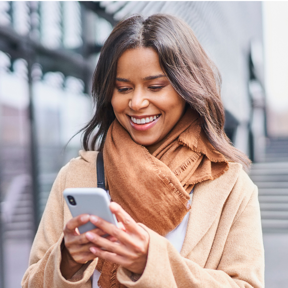 Woman on her cell phone smiling